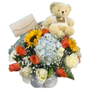 Flores surtidas y peluche