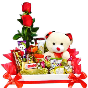 Chocolates, rosas y peluche